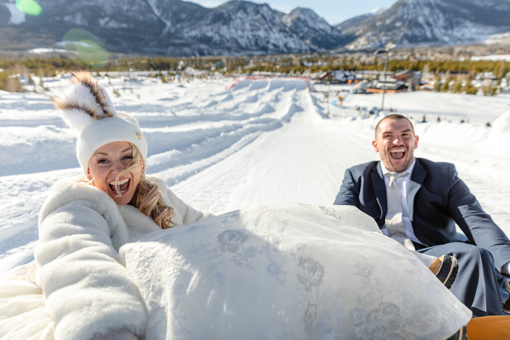Couple snow tubing after Colorado Micro Wedding