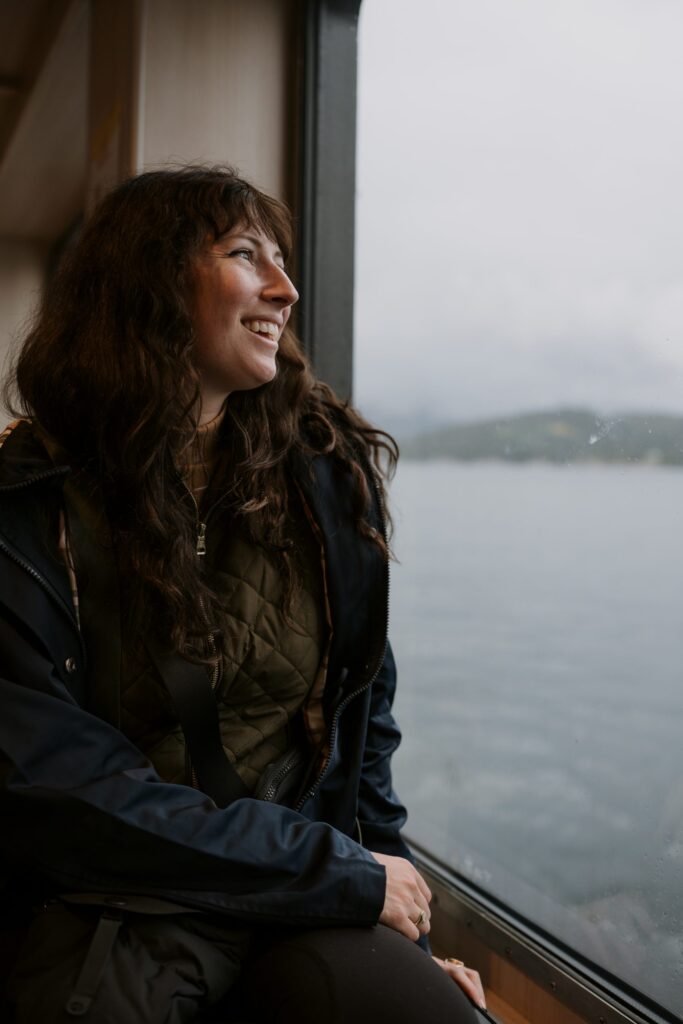 Portrait of a smiling women with dark hair looking to the side